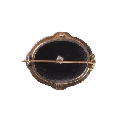 Lot 12 - A Victorian split pearl, onyx, and enamel brooch