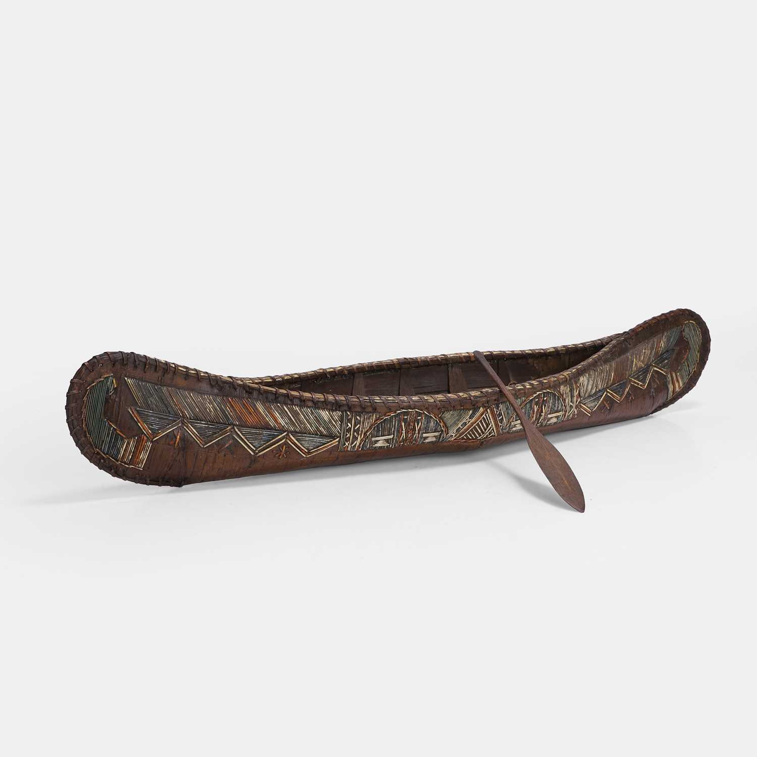 Lot 472 - A porcupine quillworked birchwood model of a canoe
