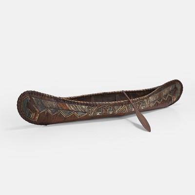 Lot 472 - A porcupine quillworked birchwood model of a canoe