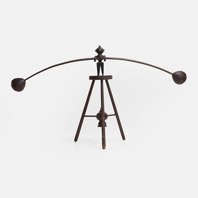 Lot 146 - A wood and metal-mounted trapeze toy