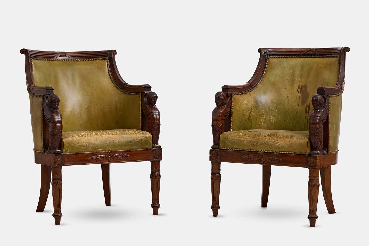 Lot A pair of Empire mahogany bergère library armchairs