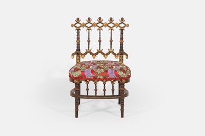 Lot 153 - An Aesthetic period ebonised, painted and parcel-gilt wooden low chair