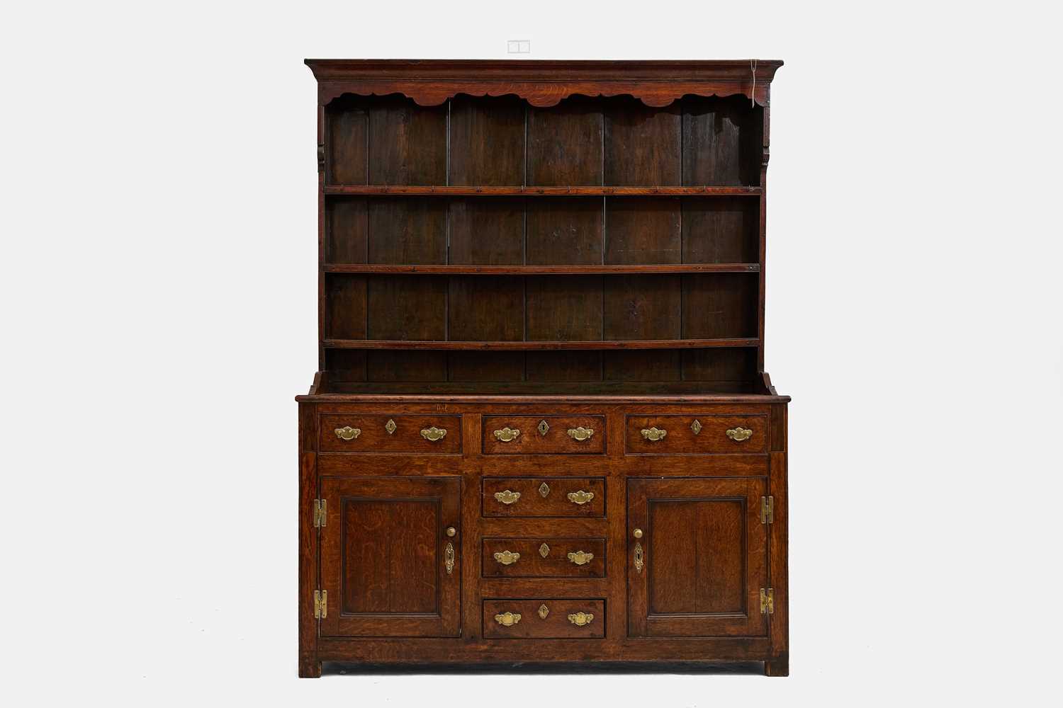 Lot 367 - A George III oak high-back dresser