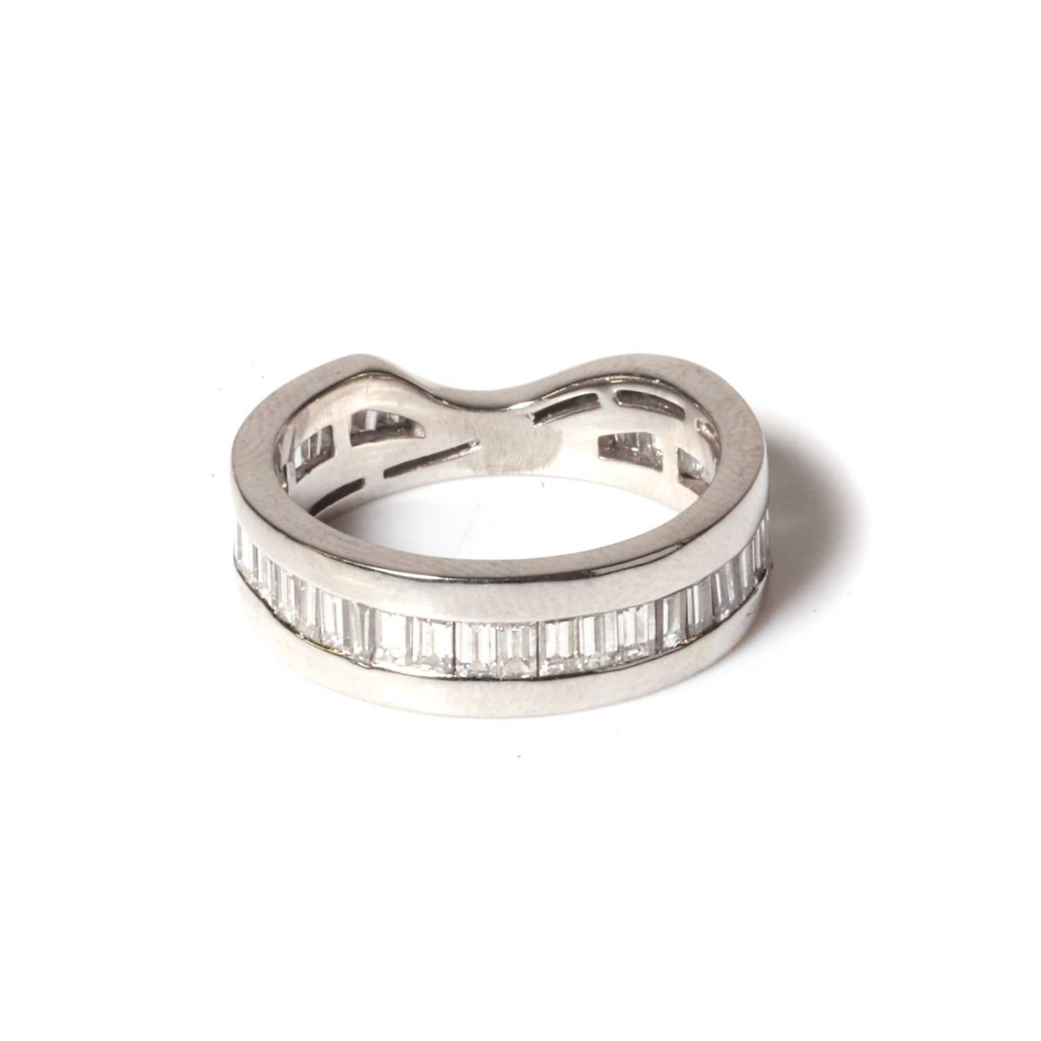 Lot 71 - A platinum and diamond fitted wedding band