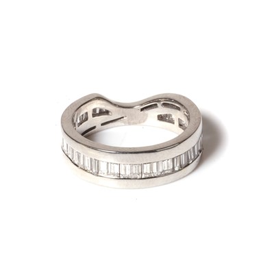 Lot 71 - A platinum and diamond fitted wedding band