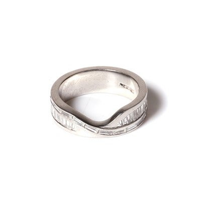 Lot 71 - A platinum and diamond fitted wedding band