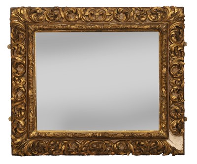 Lot 491 - An ornate carved and giltwood mirror