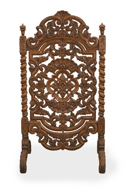 Lot 535 - A pierced walnut fire screen