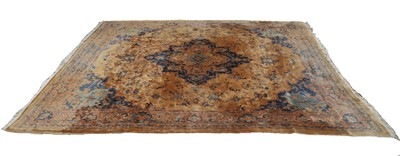 Lot 433 - A large brown ground Persian carpet