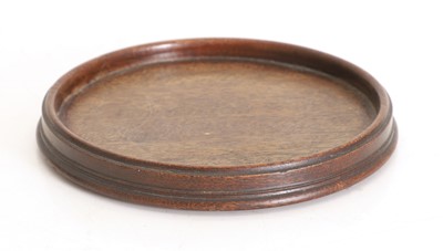 Lot 533 - A turned mahogany wine coaster