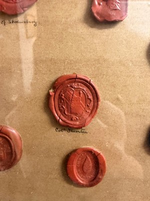 Lot 87 - A framed group of wax seals