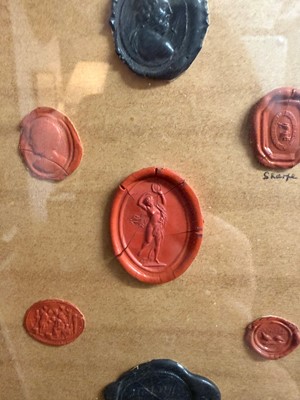 Lot 87 - A framed group of wax seals