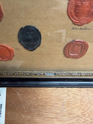 Lot 87 - A framed group of wax seals