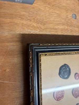 Lot 87 - A framed group of wax seals