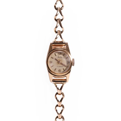 Lot 455 - A ladies' 18ct gold Mudu mechanical bracelet watch