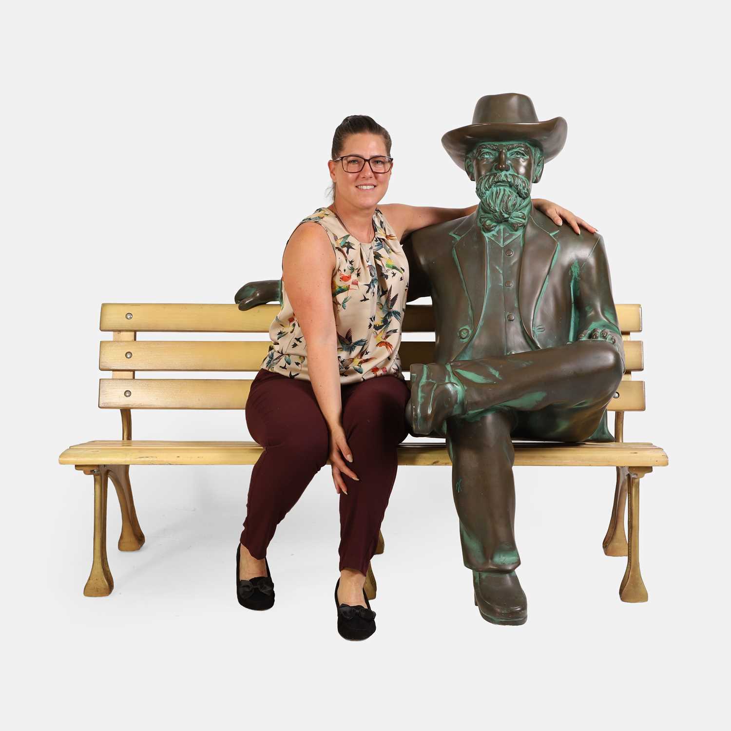 Lot 152 - Jack Daniel seated on a bench