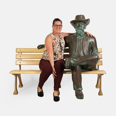 Lot 152 - Jack Daniel seated on a bench