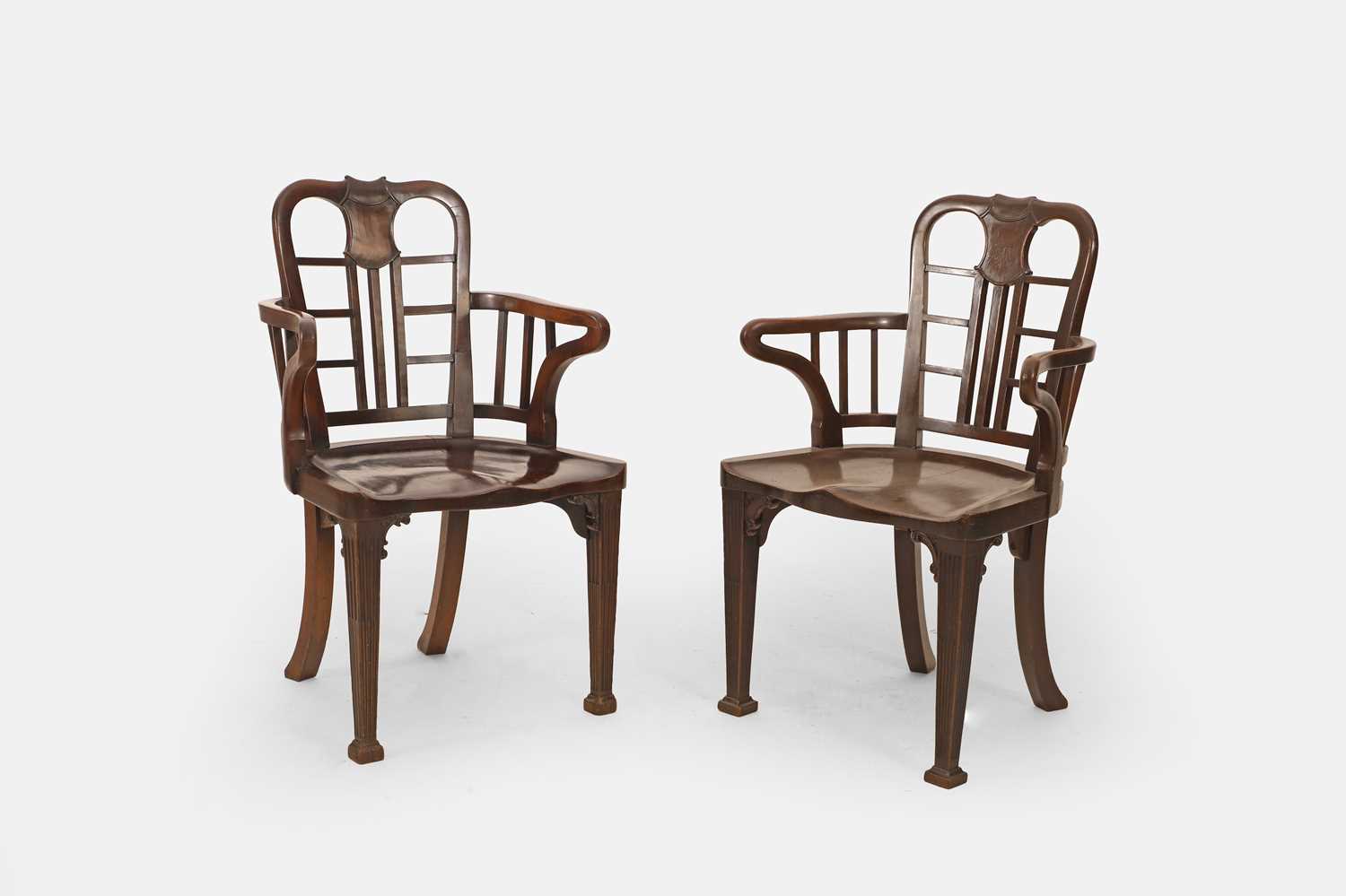 Lot 57 - A pair of George II-style mahogany hall chairs