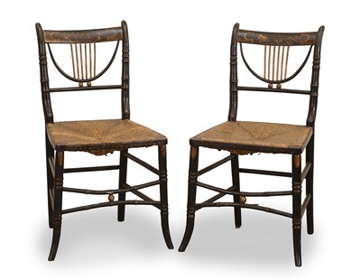 Lot 519 - A pair of Regency black and gilt-japanned wooden side chairs