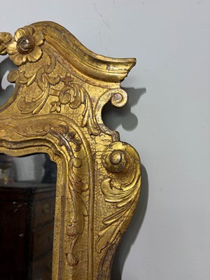 Lot 60 - A George II carved giltwood and gesso pier mirror