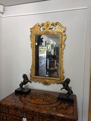 Lot 60 - A George II carved giltwood and gesso pier mirror