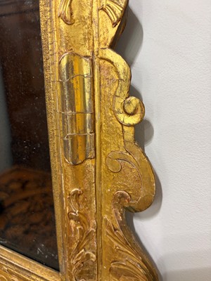 Lot 60 - A George II carved giltwood and gesso pier mirror