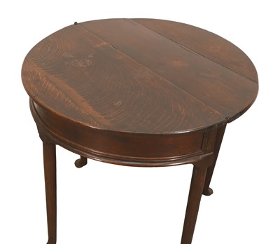 Lot 523 - A George II oak games table