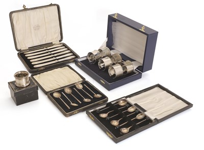 Lot 19 - A cased set of six silver napkin rings