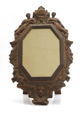 Lot 492 - A carved oak easel back mirror