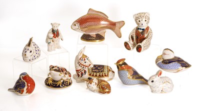 Lot 107 - A collection of eleven Royal Crown Derby porcelain paperweights