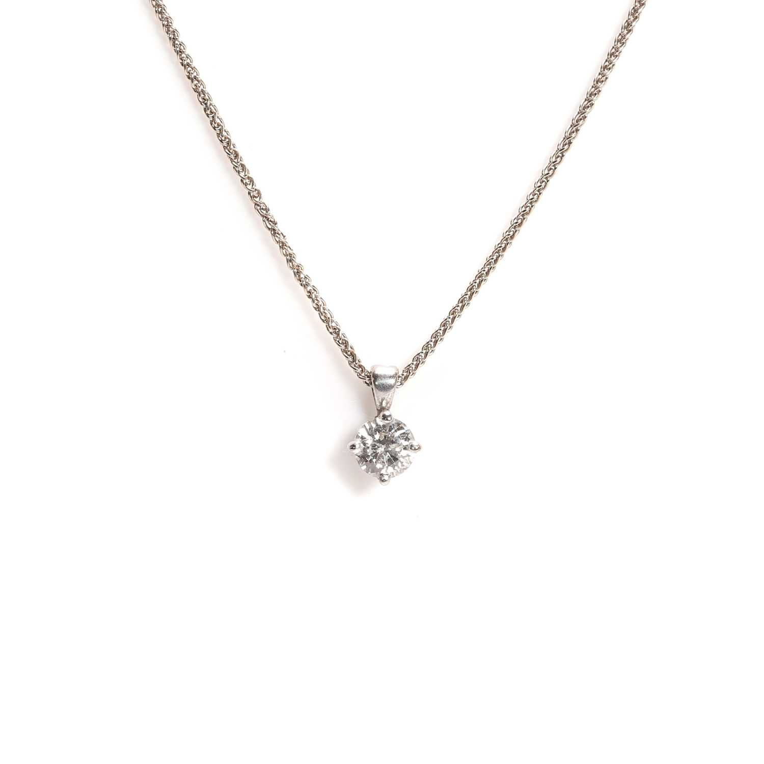 Lot 70 - An 18ct white gold diamond single stone pendant necklace
