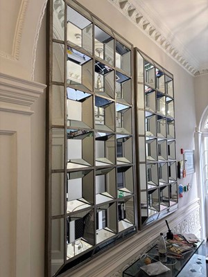 Lot 493 - A pair of large silvered rectangular wall mirrors by OKA