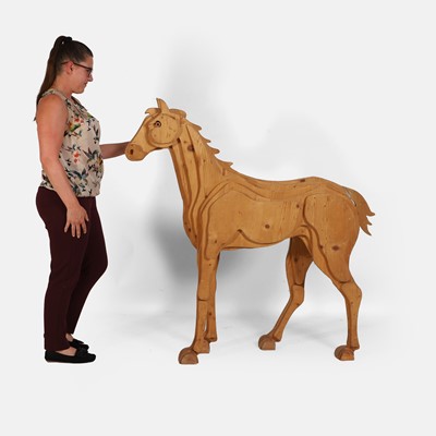 Lot 143 - A pine block horse