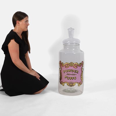 Lot 411 - A Victorian apothecary 'Powder Puffs' clear glass jar and cover