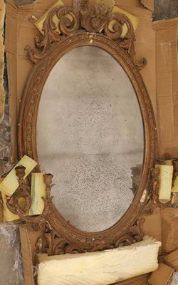 Lot 495 - An oval giltwood and gesso mirror