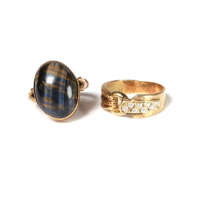 Lot 219 - A hawk's eye single stone ring and a colourless gemstone set ring
