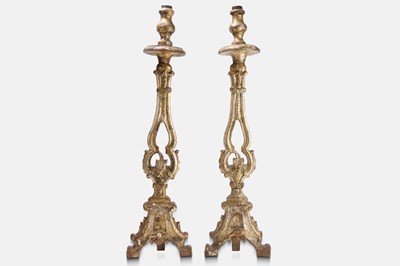 Lot 179 - A pair of baroque giltwood and silvered altar candlesticks
