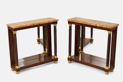 Lot 314 - A pair of Regency-style mahogany and parcel-gilt pier tables