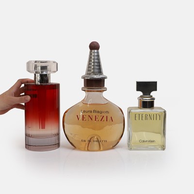 Lot 421 - Three oversized glass perfume and eau de toilette advertising bottles