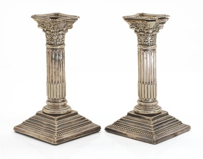 Lot 23 - A pair of Edwardian Corinthian column candlesticks