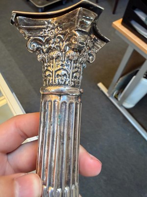Lot 23 - A pair of Edwardian Corinthian column candlesticks