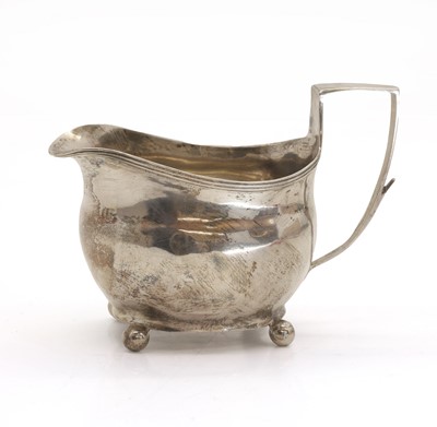 Lot 28 - A Georgian silver cream jug