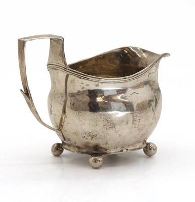 Lot 28 - A Georgian silver cream jug