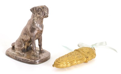 Lot 11 - A silver cased resin dog
