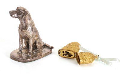 Lot 11 - A silver cased resin dog