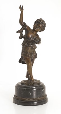 Lot 253 - A bronze figure of a putti