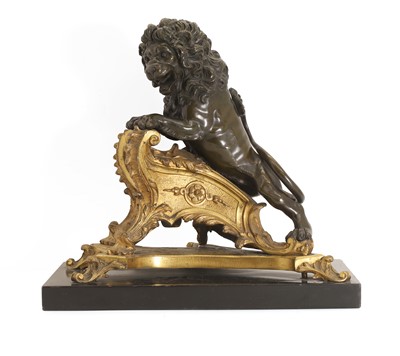 Lot 254 - A gilt and patinated bronze animalier chenet