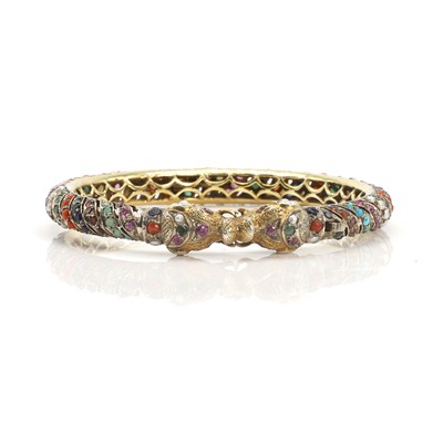 Lot 156 - An Indian multi-gemstone hinged bangle