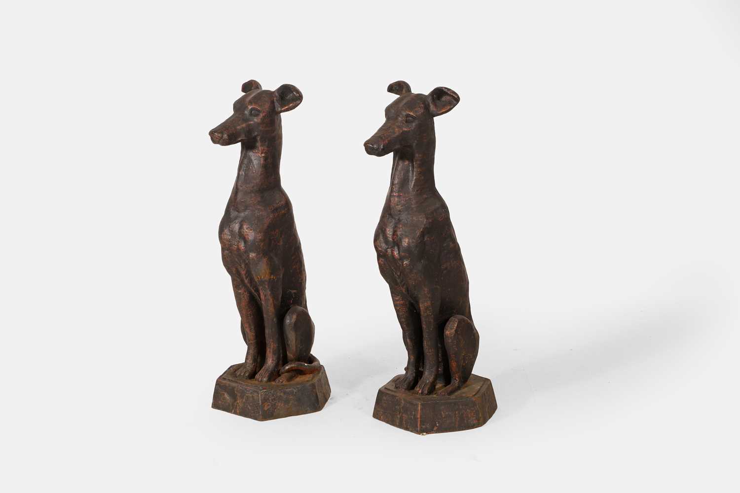 Lot A pair of patinated cast iron whippets
