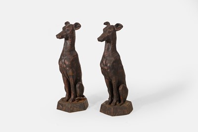 Lot A pair of patinated cast iron whippets